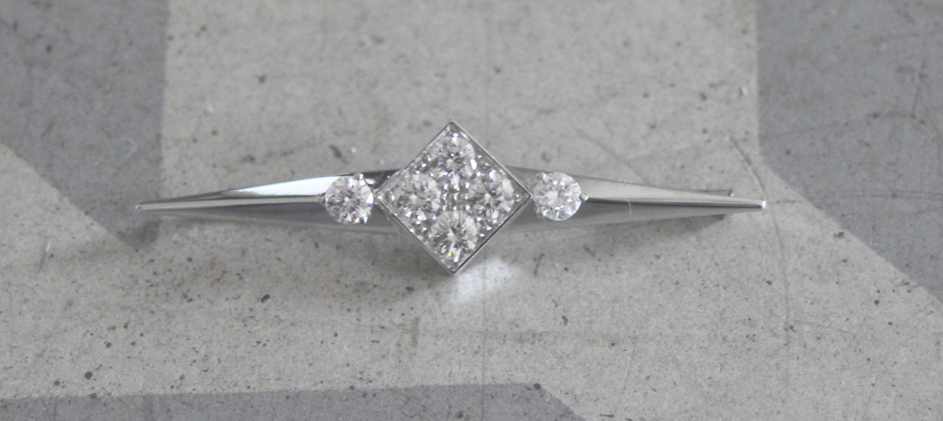 Diamond brooch.