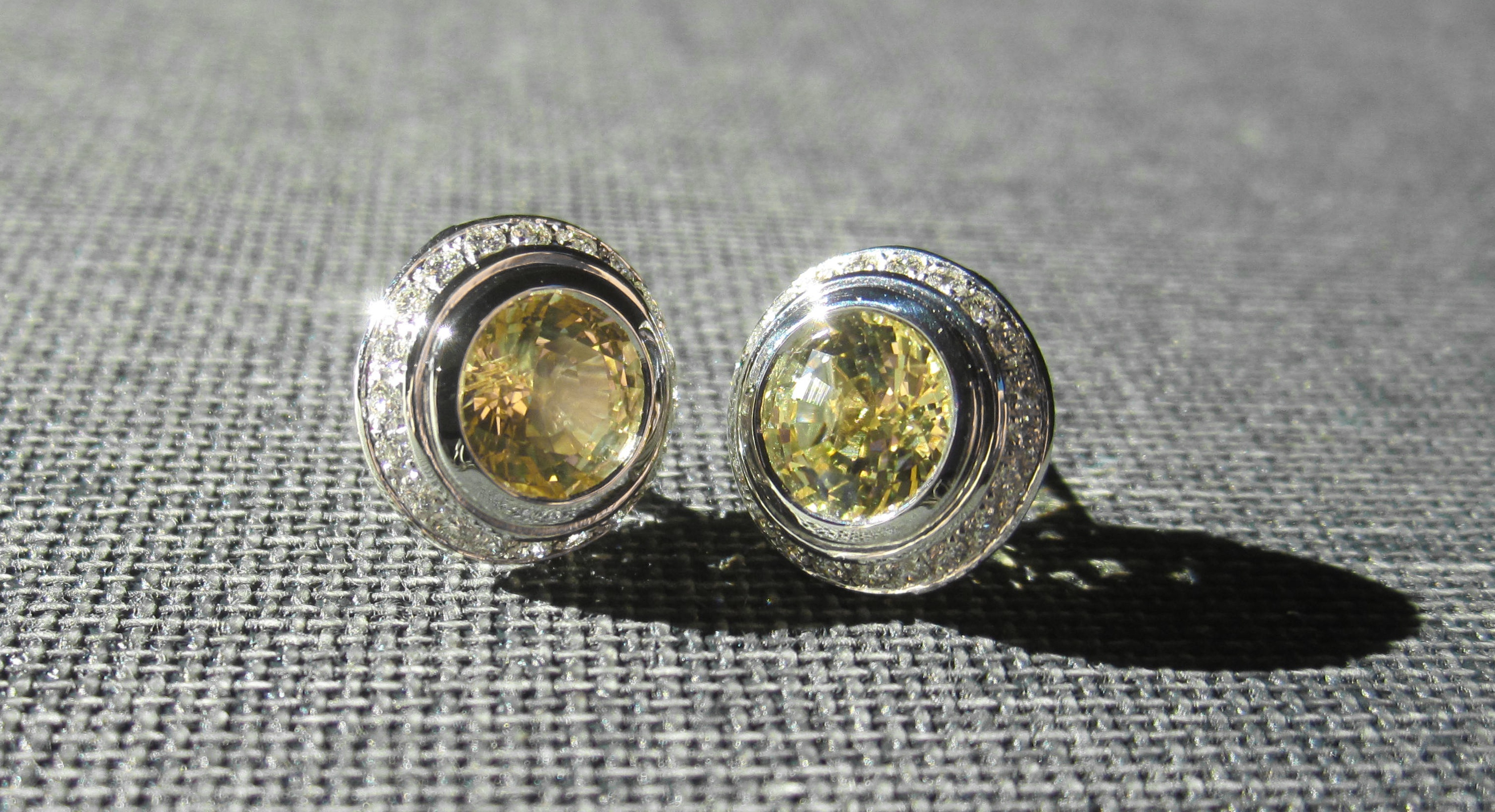 Yellow sapphires and diamonds earrings.
