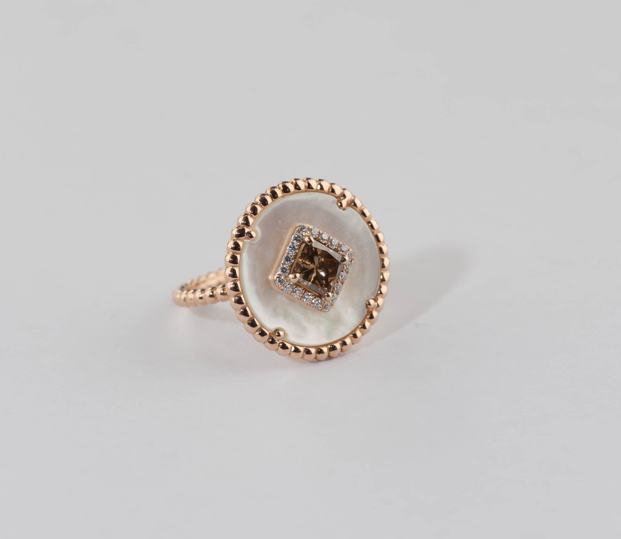 Brown diamond, mother of pearl and colorless diamonds ring.