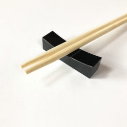 Black jadeite chopsticks rest.