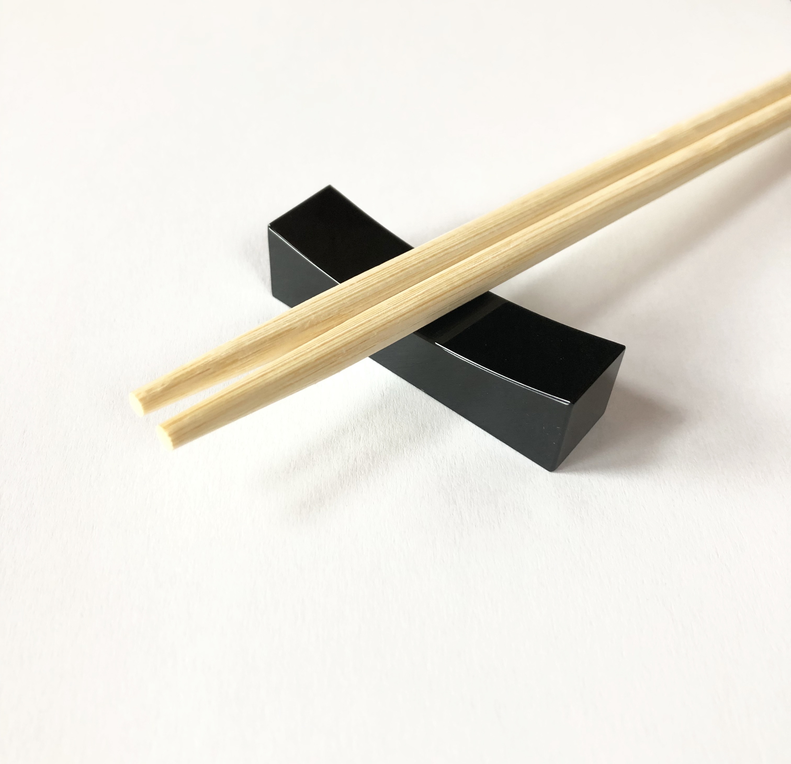 Black jadeite chopsticks rest.
